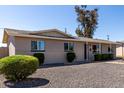 Single-story home featuring desert landscaping and ample natural light at 14842 N 36Th St, Phoenix, AZ 85032