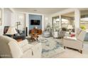 Bright living room with large windows, plush seating, and elegant rug at 156 E Leverenz Ave, Queen Creek, AZ 85140