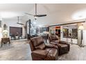 Cozy open floor plan with a spacious kitchen, modern flooring, and comfortable leather seating at 19440 N 12Th St, Phoenix, AZ 85024