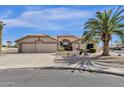 Exterior shot of this single story home with a three car garage and well manicured desert landscaping at 19791 N 86Th Dr, Peoria, AZ 85382