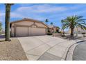 Exterior showcases a three car garage, neutral color palette, and well maintained desert landscaping at 19791 N 86Th Dr, Peoria, AZ 85382