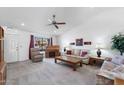 Spacious living room featuring vaulted ceilings, neutral carpeting, and a cozy seating arrangement at 2736 Leisure World --, Mesa, AZ 85206