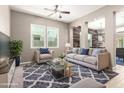 Inviting living room featuring neutral tones, plush seating, modern decor, and great natural light at 3023 E Arabian Dr, Gilbert, AZ 85296