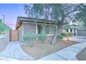Charming front exterior featuring brick accents and lush landscaping, enhanced by a paver walkway at 3153 E Ivanhoe St, Gilbert, AZ 85295