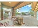 Inviting front porch with brick pillars and cozy seating, perfect for enjoying the neighborhood views at 3153 E Ivanhoe St, Gilbert, AZ 85295