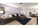 Inviting living room with plush seating, accent rug, and neutral color scheme at 317 W Tonopah Dr # 2, Phoenix, AZ 85027