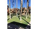 Condos viewed through palm trees and their shadows across the green grass at 3500 N Hayden Rd # 2103, Scottsdale, AZ 85251