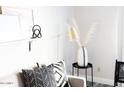 Relaxing living room corner with decorative pillows, a modern lamp, and a stylish side table at 3500 N Hayden Rd # 2103, Scottsdale, AZ 85251