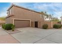 Spacious two-car garage with ample driveway space and a neatly fenced side yard at 4002 E Melinda Ln, Phoenix, AZ 85050
