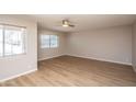 Bright and spacious bedroom featuring wood-look floors and a ceiling fan at 4502 E Carol Ave # 1, Mesa, AZ 85206