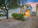Inviting home with mature landscaping, a two-car garage, and a welcoming entrance at 5110 E Peak View Rd, Cave Creek, AZ 85331