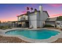 Backyard featuring a private pool, patio area, and upper-level balcony at 6237 W Altadena Ave, Glendale, AZ 85304