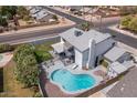 Aerial view of the home showcasing a sparkling pool, patio area, and manicured lawn for outdoor enjoyment at 6237 W Altadena Ave, Glendale, AZ 85304