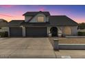 Charming single-Gathering home featuring a three-car garage and well-maintained front yard at 6237 W Altadena Ave, Glendale, AZ 85304