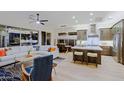 Bright and open living room flowing into the kitchen with modern design and ample seating at 6936 E Whispering Mesquite Trl, Scottsdale, AZ 85266