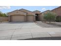 Charming single-story home with a three-car garage and well-maintained landscaping at 9698 S 183Rd Ave, Goodyear, AZ 85338