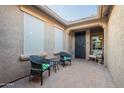 Private front courtyard with seating area, offering a tranquil space to relax outdoors at 10846 E Quartet Ave, Mesa, AZ 85212
