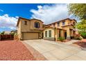 Spacious two-story home with a large driveway and well-maintained landscaping at 13932 N 135Th Dr, Surprise, AZ 85379