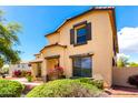 Lovely front yard and attractive home exterior, creating a warm, welcoming atmosphere at 13932 N 135Th Dr, Surprise, AZ 85379