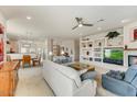 Open living space with tile and carpet, fireplace, media center and dining area at 15201 N Zapata Dr, Fountain Hills, AZ 85268