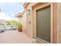 Inviting entryway with a decorative door, stylish light fixture and a welcome mat at 16013 S Desert Foothills Pkwy # 2055, Phoenix, AZ 85048