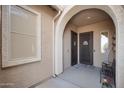 Inviting entryway featuring a security door, decorative window, and a neutral color palette at 24127 N 166Th Ct, Surprise, AZ 85387