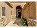 Arched entry way with stone pillars and tiled walkway, cactus landscaping at 26521 N 114Th Pl, Scottsdale, AZ 85255