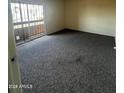 Simple bedroom with a balcony and neutral carpet offers a blank canvas at 2666 N 43Rd Ave # C, Phoenix, AZ 85009
