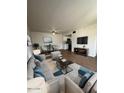 Bright living room featuring hardwood floors, modern furniture, and a dining area at 2666 N 43Rd Ave # C, Phoenix, AZ 85009