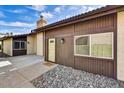 A lovely home with a stone garden and an inviting entrance with a yellow door at 3154 E Clarendon Ave, Phoenix, AZ 85016