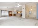 Bright, open-concept living area flows into the kitchen, perfect for modern living and entertaining at 3417 W Abraham Ln, Phoenix, AZ 85027
