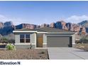 Single story home with neutral tones, a two-car garage and desert landscaping at 5016 S 106Th Ln, Tolleson, AZ 85353