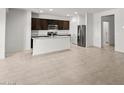 Open-concept kitchen with stainless steel appliances and granite countertops at 5053 S 252Nd Ave, Buckeye, AZ 85326