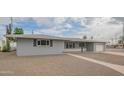 Inviting single-story home with a well-manicured front yard and attached garage at 5401 E Cicero St, Mesa, AZ 85205