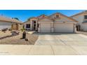 Charming single-Gathering home showcasing a well-manicured desert landscape and a two-car garage at 6539 W Briles Rd, Phoenix, AZ 85083