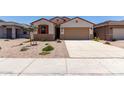 Charming single-story home with a two-car garage, low-maintenance landscaping, and a welcoming front entrance at 7417 E Hackamore Ln, San Tan Valley, AZ 85143