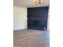Living room featuring modern lighting, vinyl floors and a fireplace at 7637 E Akron St, Mesa, AZ 85207