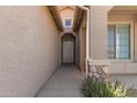 Inviting entryway with a security screen door, lush plants, and a view of the sky at 10245 W Parkway Dr, Tolleson, AZ 85353