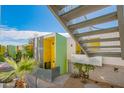 Community exterior showcasing modern architecture with colorful accents and desert landscaping at 1111 W University Dr # 2012, Tempe, AZ 85281