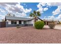 Beautiful house featuring desert landscaping, green bushes, and gray accent paint at 1153 W Mesquite St, Chandler, AZ 85224