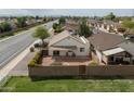 Aerial view of the home's fenced backyard featuring gravel, plants and covered seating area at 1200 W Boxelder Cir, Chandler, AZ 85224