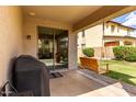 Enjoy the covered patio with a porch swing, perfect for outdoor relaxation and entertaining guests at 12057 W Ashby Dr, Peoria, AZ 85383