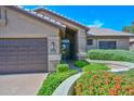 Inviting home featuring a well-manicured yard, a front-facing two-car garage, and excellent curb appeal at 15035 W Indianola Ave, Goodyear, AZ 85395