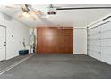 Organized garage space with storage cabinets and ample room for vehicles at 1677 W Seagull Ct, Chandler, AZ 85286