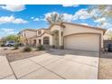 Lovely single-story house featuring a two-car garage, desert landscaping, and a spacious driveway at 2523 W Running Deer Trl, Phoenix, AZ 85085