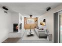 Cozy living room with a white brick fireplace and stylish furnishings at 2927 W Glenn Dr, Phoenix, AZ 85051