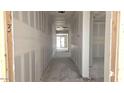Hallway view shows walls ready for paint, awaiting the final touches to transform this space at 32139 N Lone Rancher Way, San Tan Valley, AZ 85140