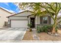 Charming single-story home features a well-manicured front yard, a two-car garage, and a welcoming entrance at 3219 W Pollack St, Phoenix, AZ 85041