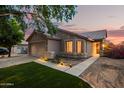 Beautiful exterior view of a cozy home with manicured lawn and charming curb appeal at 3922 N 125Th Dr, Avondale, AZ 85392