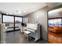 Well-lit office space with large windows and city views includes a piano, desk, and modern decor at 4808 N 24Th St # 1424, Phoenix, AZ 85016